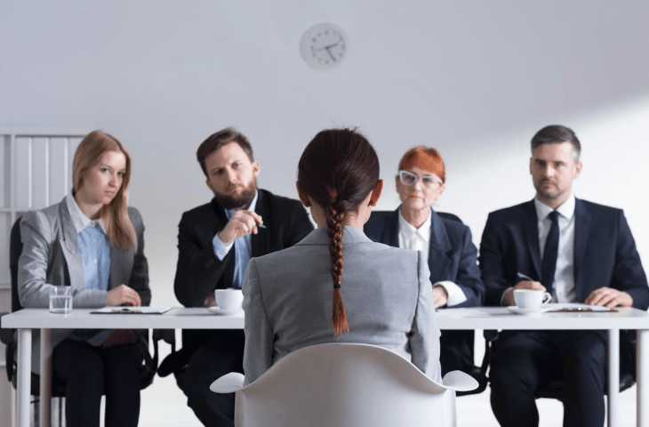 Four business persons holding an interview