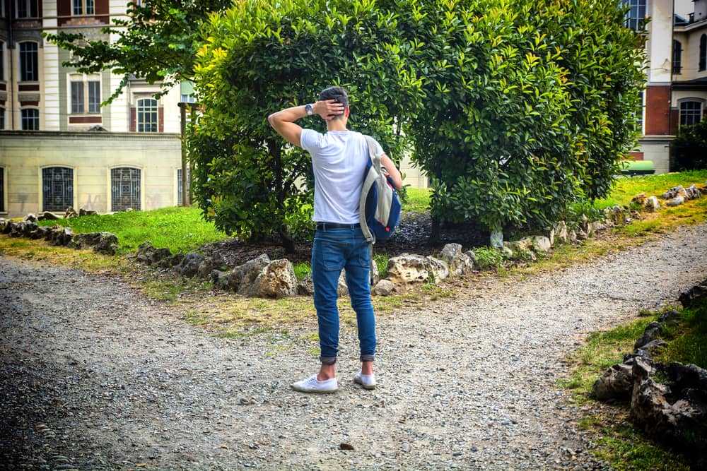 Man looking at direction to go through
