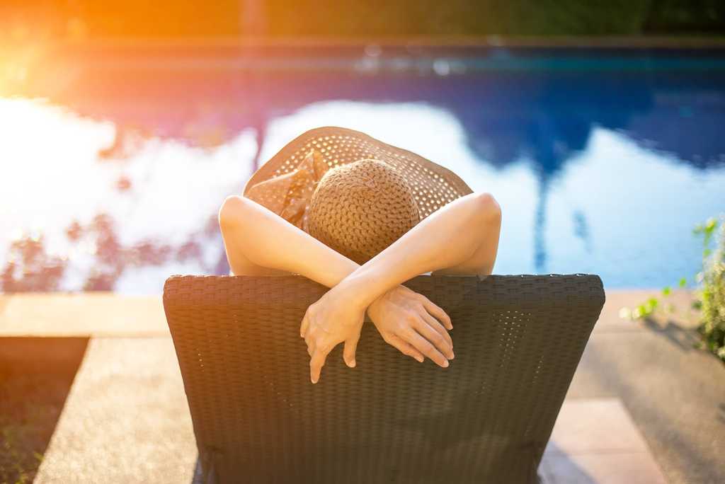 Woman relaxing near the pool
