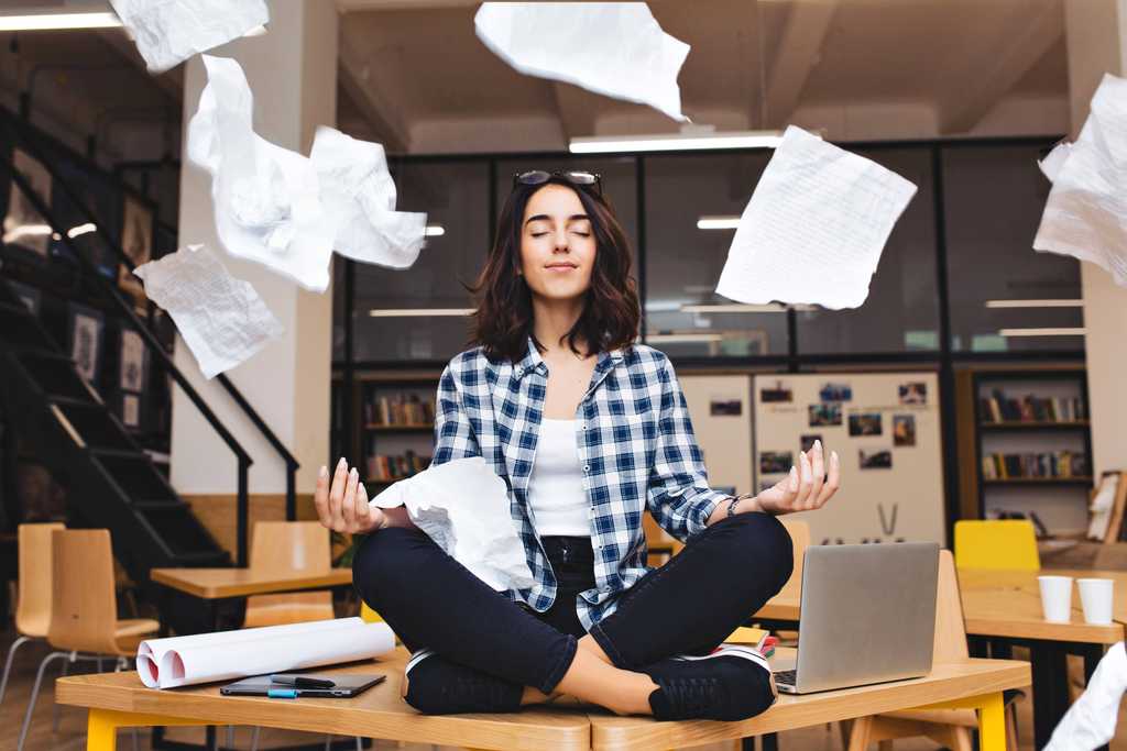 Woman meditating on desk