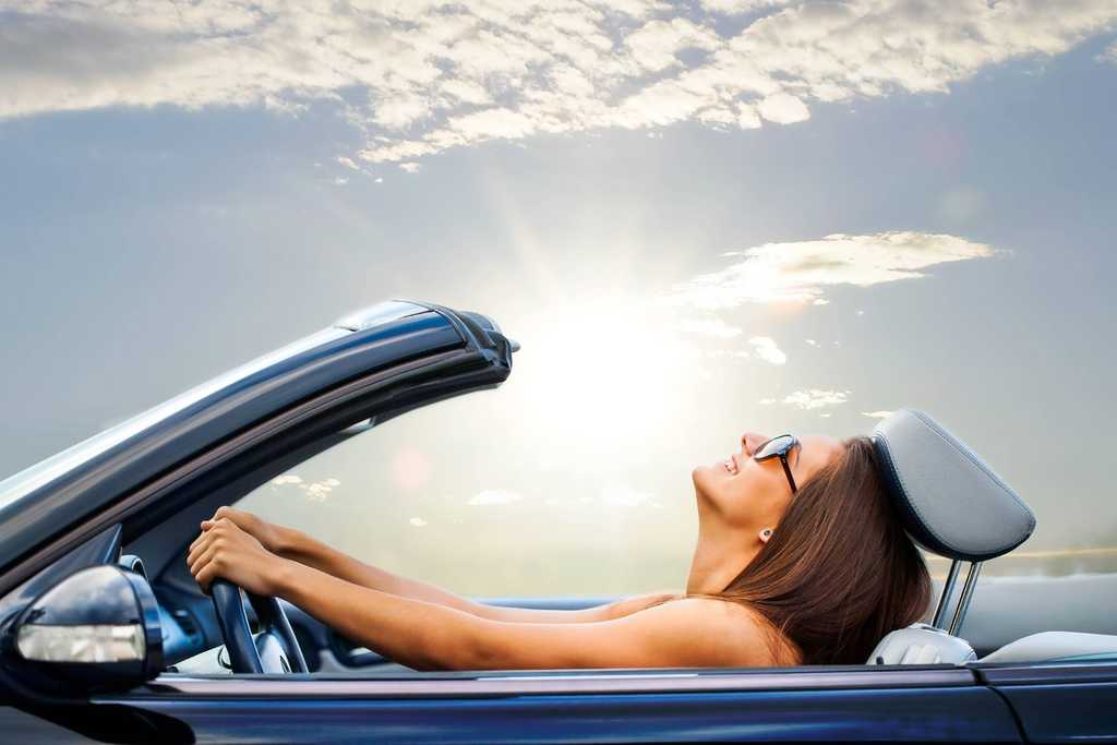 Woman happily driving