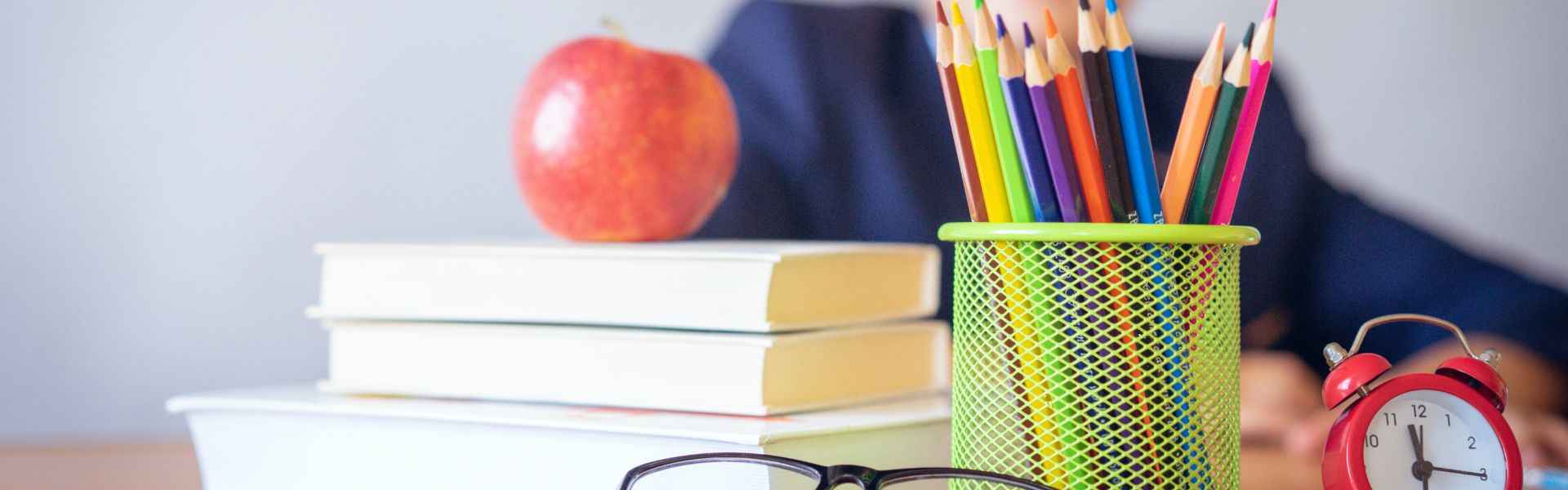 school stationery and books on a desk