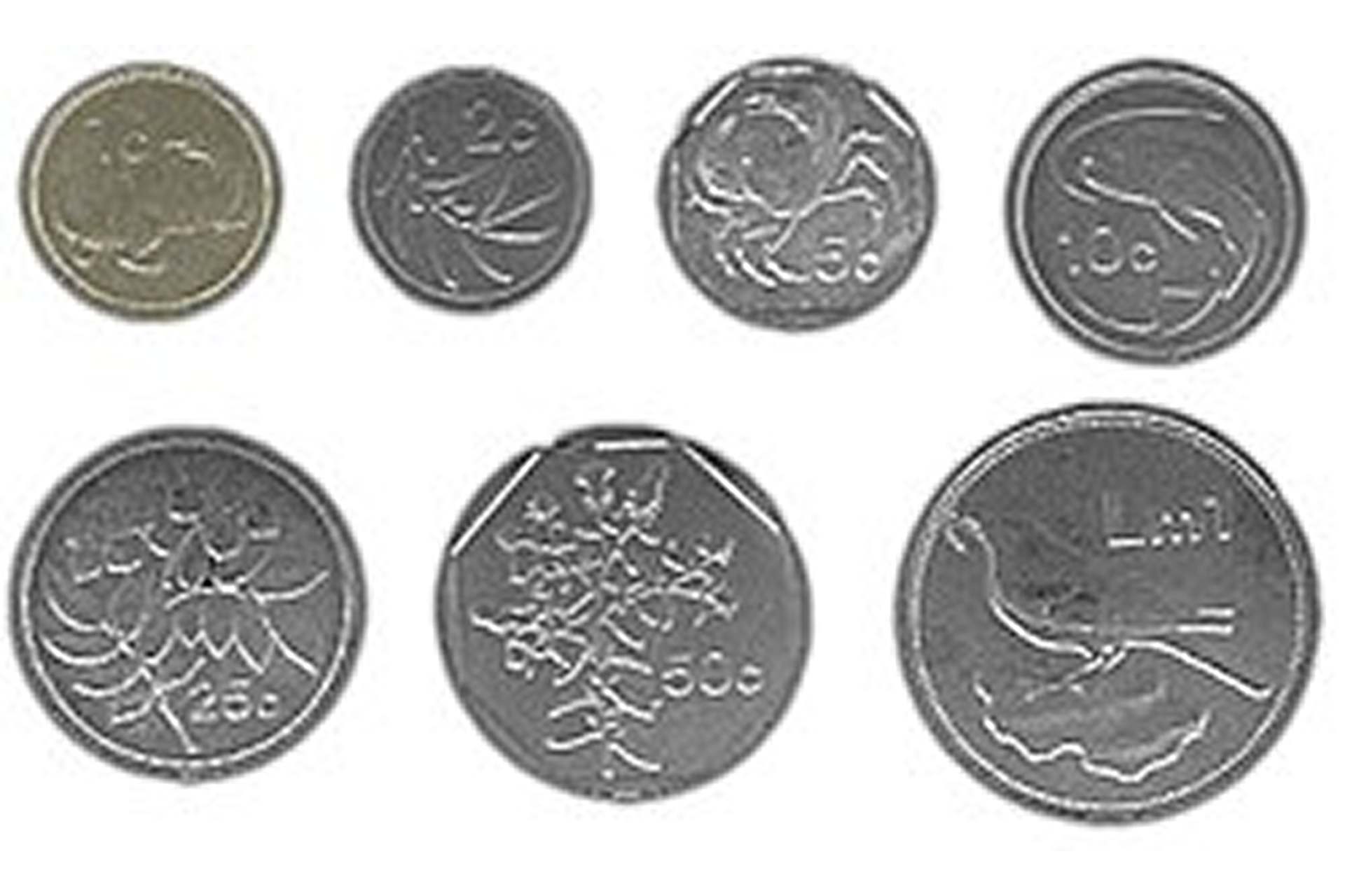 Seven Maltese Lira coins from 1c to Lm1, showing designs of local flora and fauna including the national bird on the reverse of the Lm1 piece.