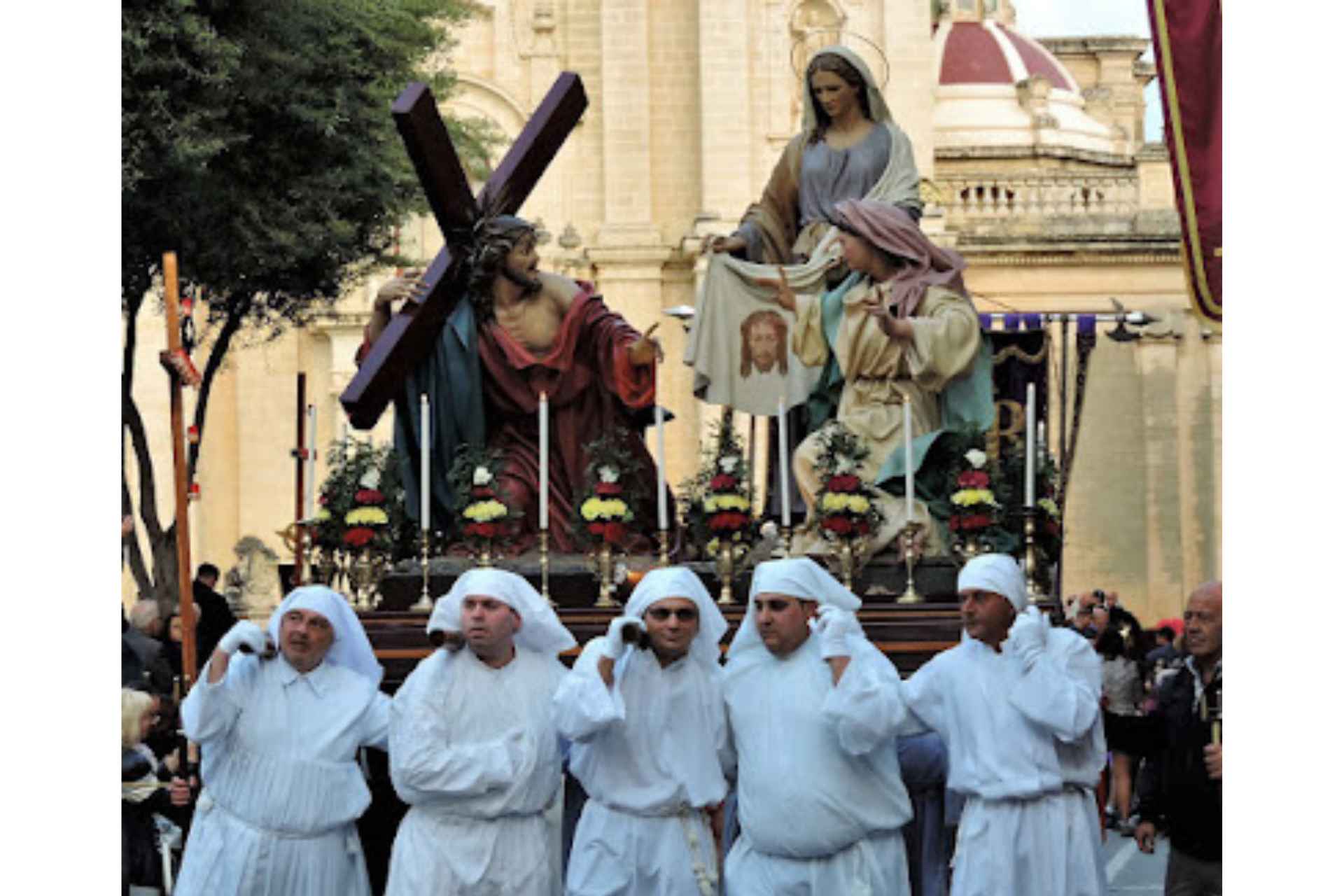 people carrying Holy Week statue