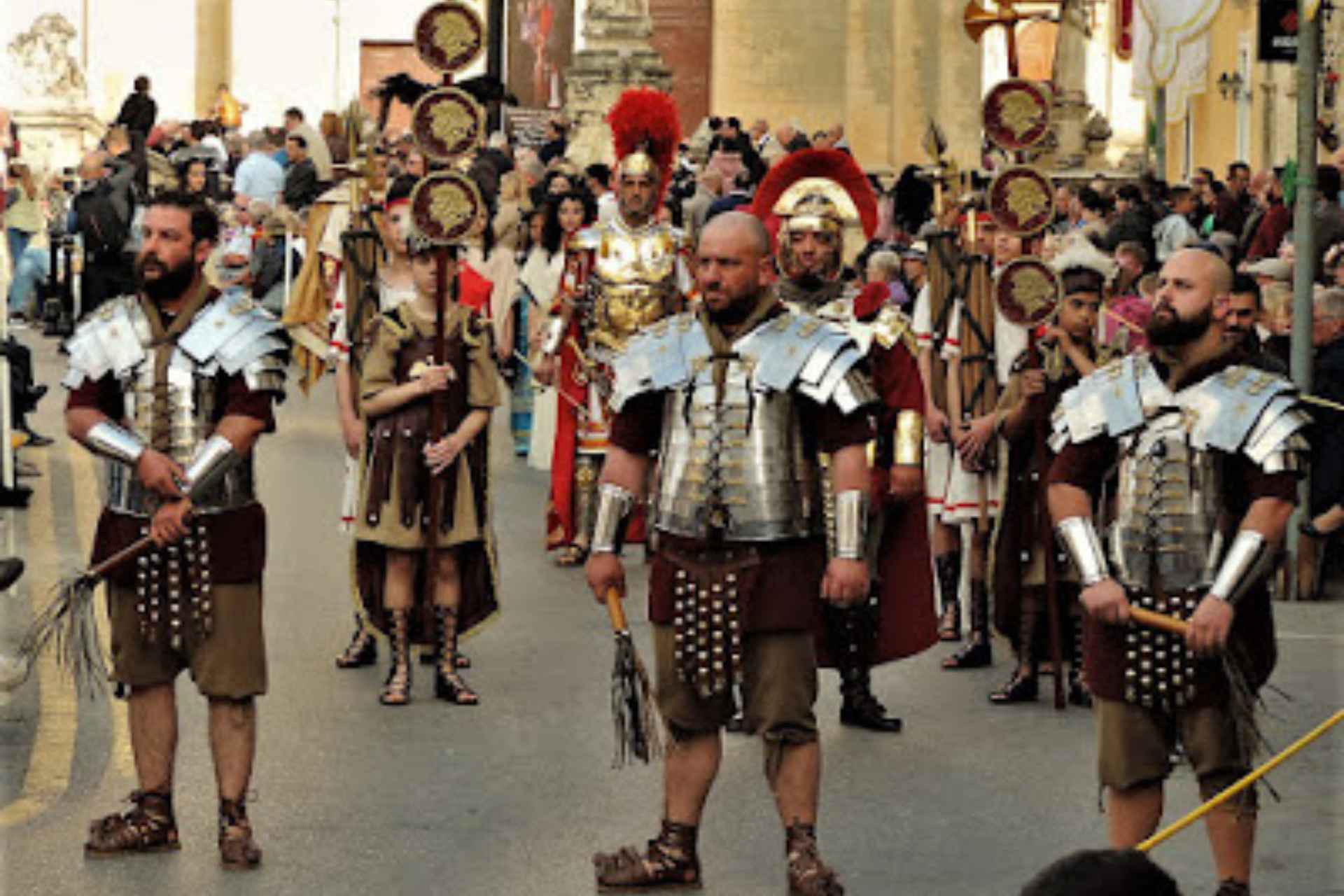 people marching in roman soldier costumes