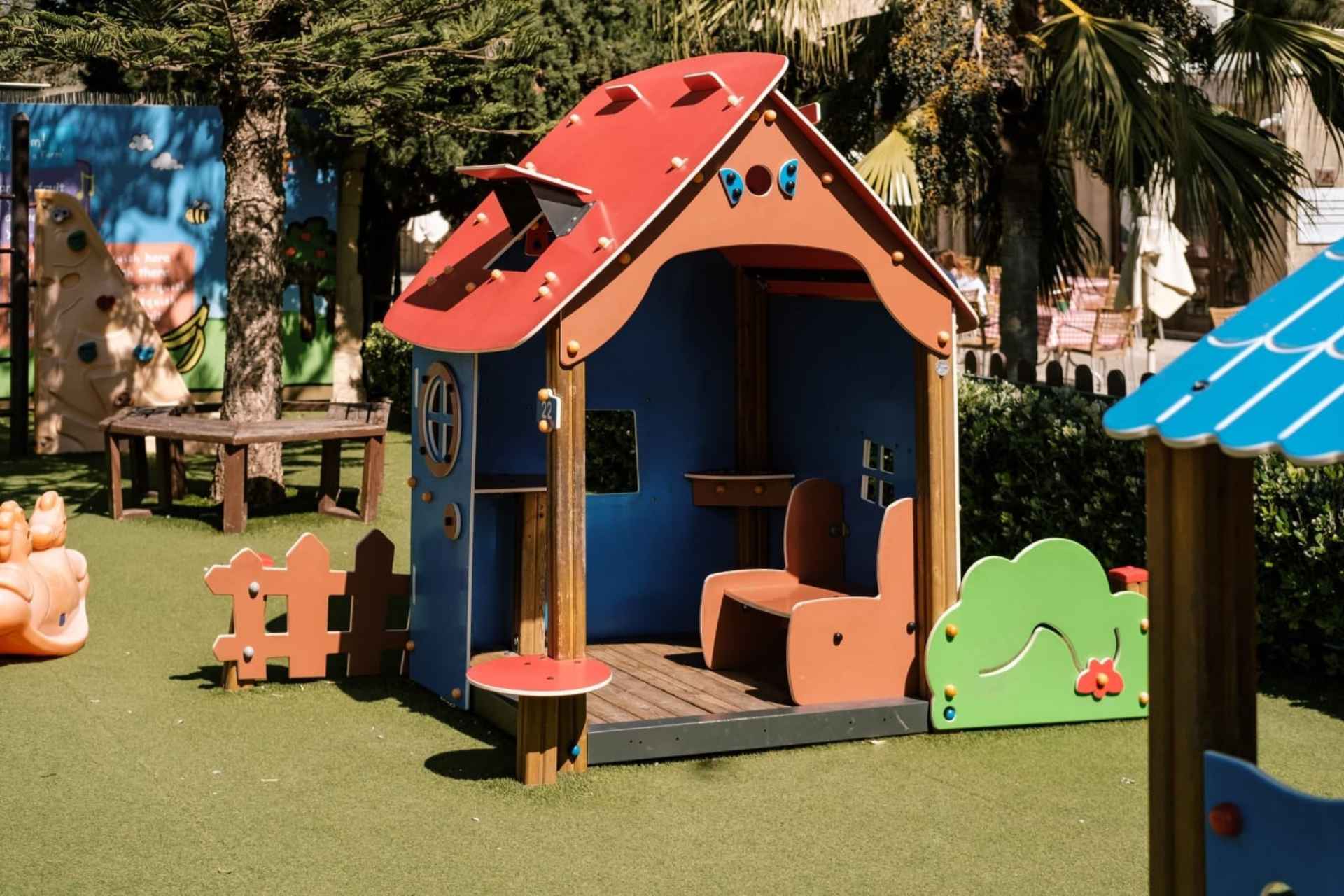 a kids' playhouse in a playground